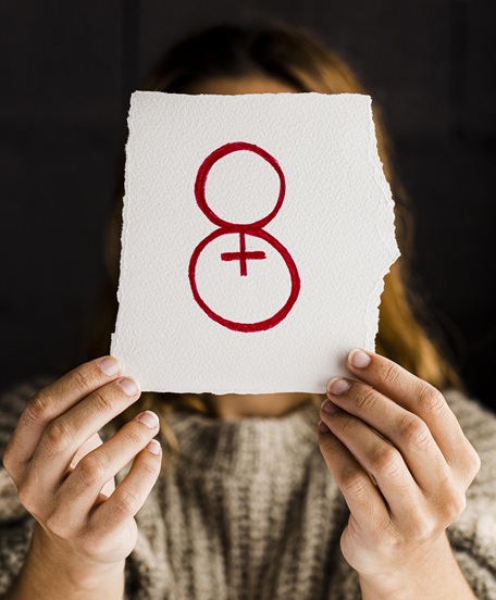 person-holding-paper-women-s-day-front-view
